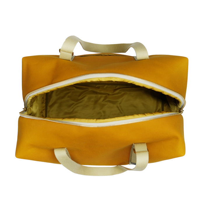 Maggie Felisi travel bag made of double mustard-colored technical canvas and adjustable beige cotton handles