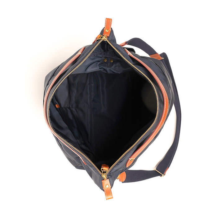 Hun-di-Felisi-borsa-a-mano-e-tracolla-in-nylon-tecnico-blu-con-finiture-in-pelle-di-vacchetta-chiaro-e-minuteria-metallica-ottone-e-foderata-in-cotone-nero